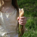child foraging spring cattail tips