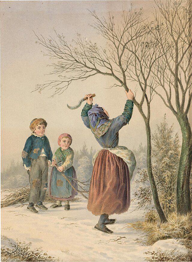 a woman using a billhook to cut a tree branch over her head with two children standing in the background watching her.
